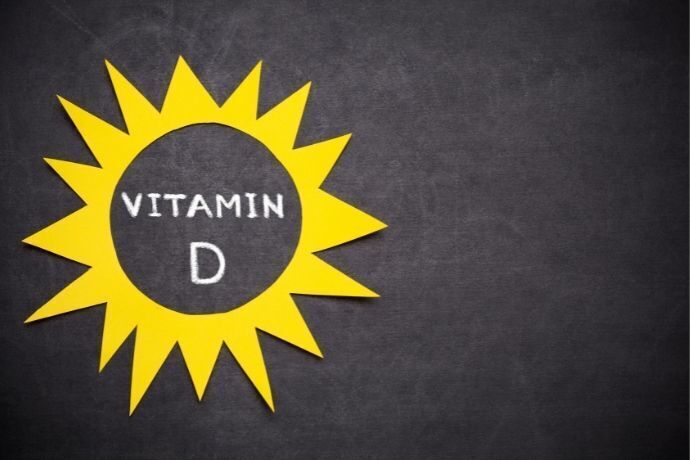 Desenho de sol escrito "vitamin D" dentro dele