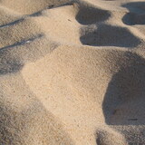 Sonhar com areia: branca, preta, de praia, construção, movediça e mais!
