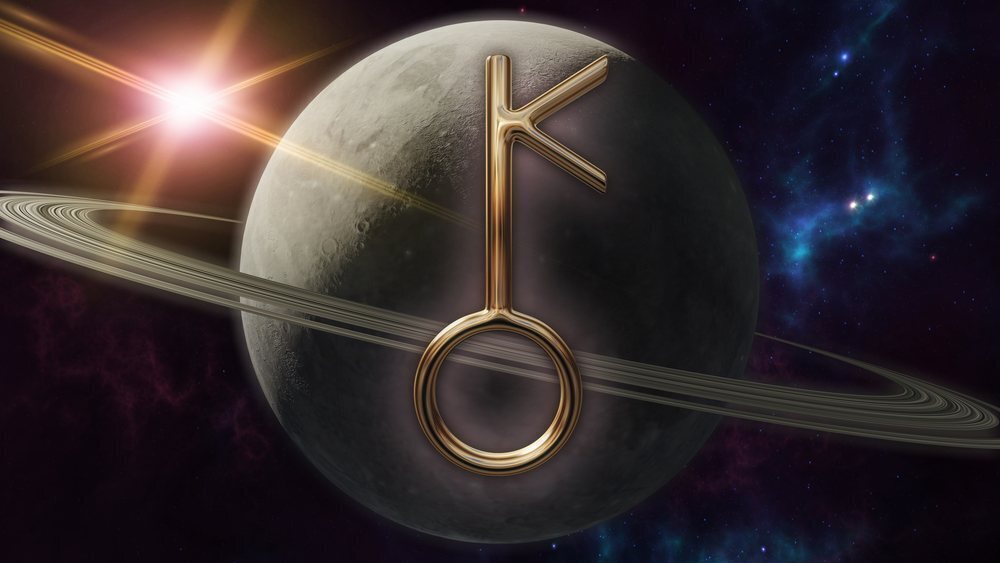Símbolo de Quíron na frente de planetas.