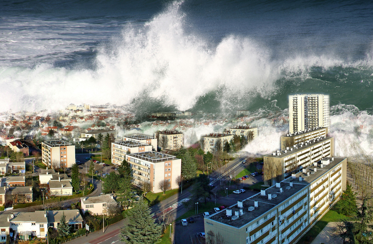 Onda de tsunami destruindo parte de uma cidade.