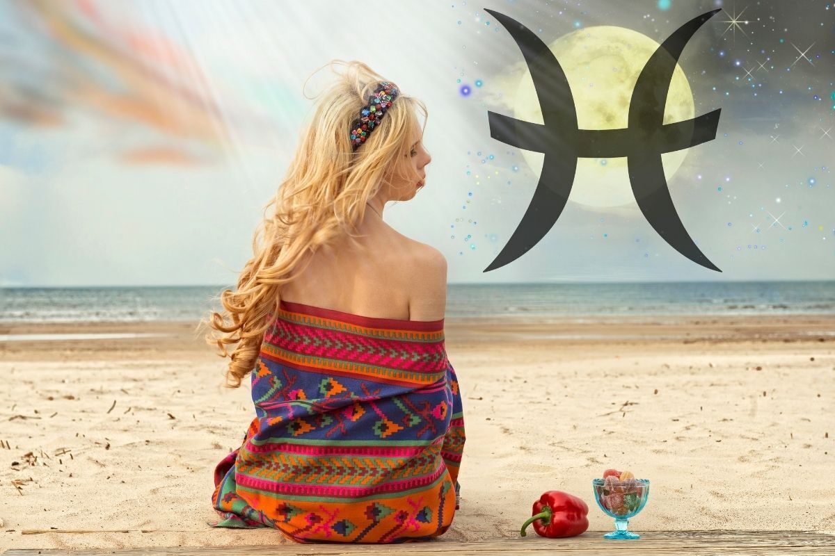 Mulher sentada na Praia, representando o signo de Peixes