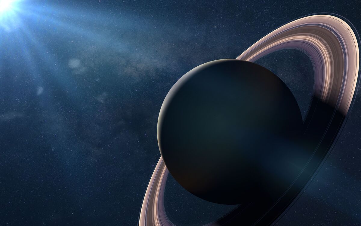 Saturno sendo iluminado por luz.