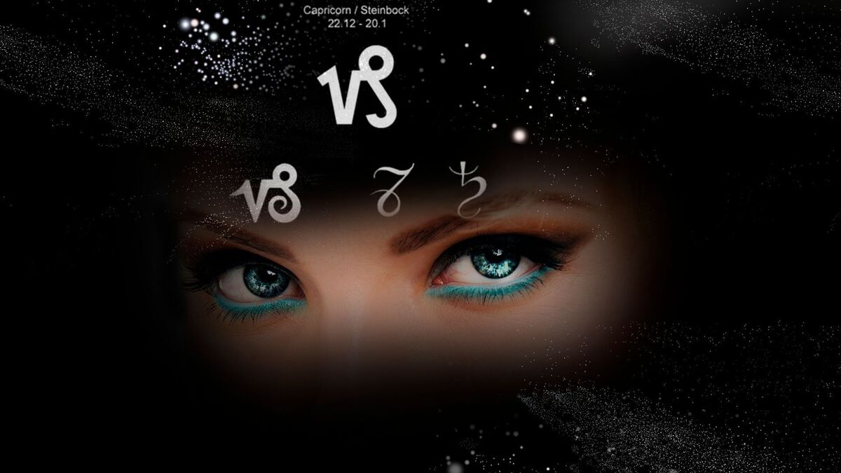 Olhos de mulher com o símbolo de Capricórnio.
